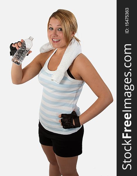 Attractive young woman wearing workout attire holding a water bottle