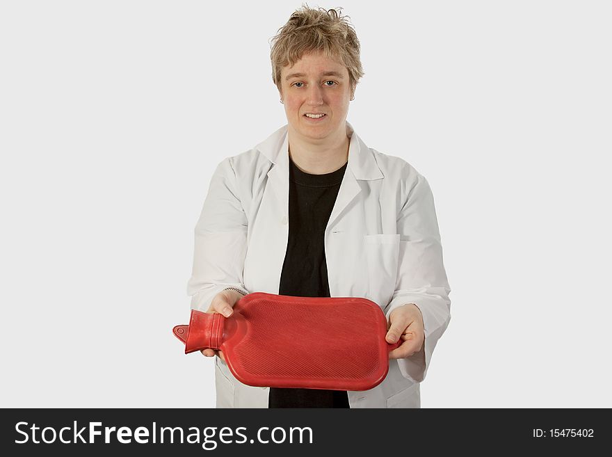 Short hair blond woman doctor holding and offering a red hot water bottle over white. Short hair blond woman doctor holding and offering a red hot water bottle over white