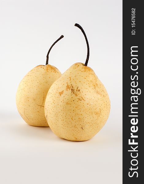 Two pears on a gray background