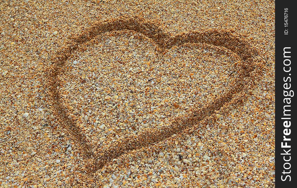 The heart drawn on sand. The heart drawn on sand