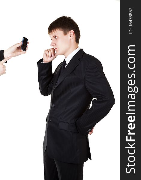 Young business man looking in mobile phone on white background