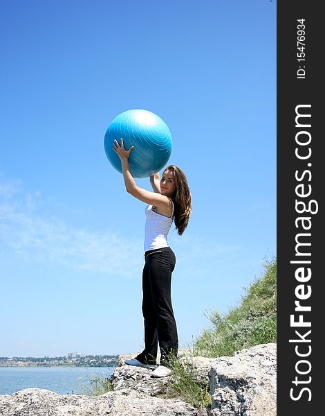 Young Woman Doing Yoga Exercises