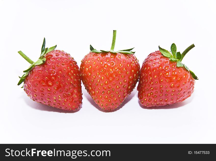 Three strawberries in white backgound