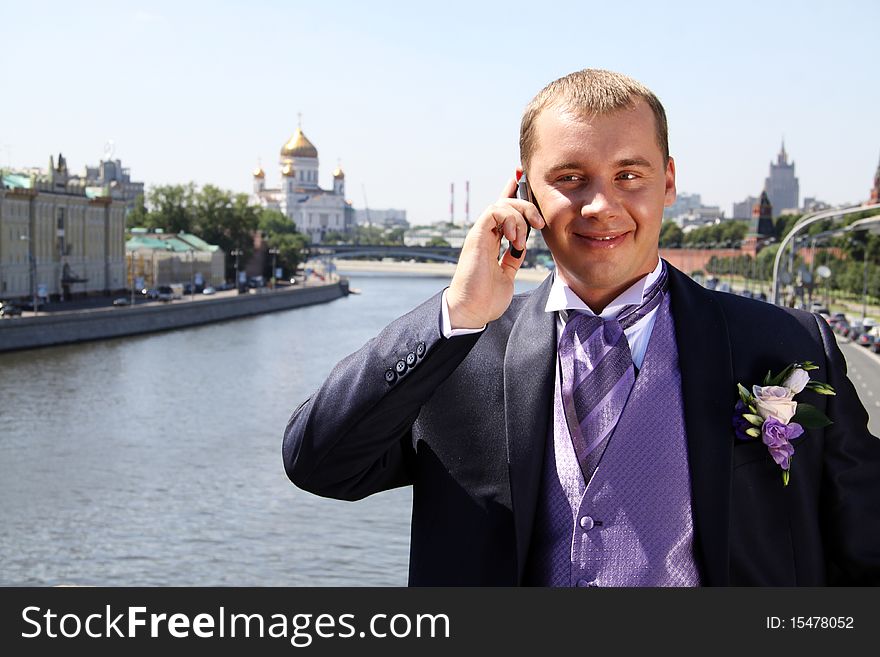 Portrait of the happy man in summer park