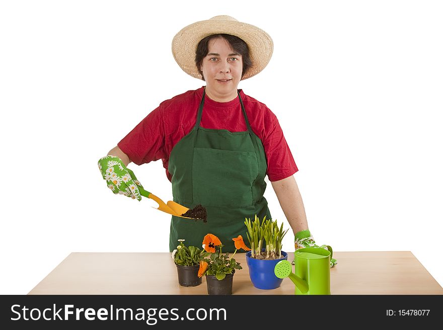Woman gardener with garden tool isolated on white background.
