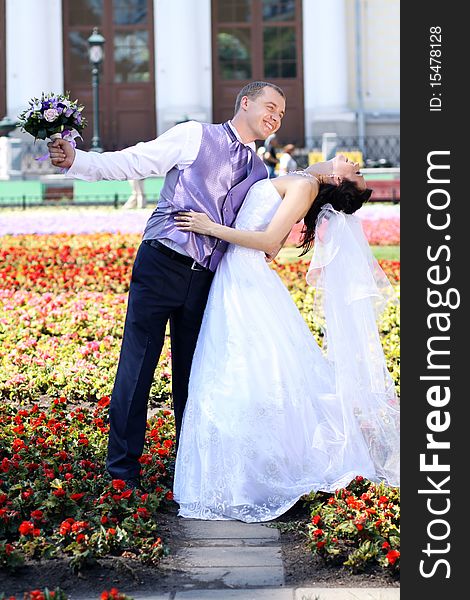 Bride and groom in summer park