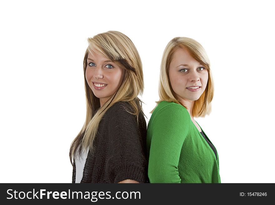 Two young caucasian girlfriends having fun together isolated over white background. Two young caucasian girlfriends having fun together isolated over white background