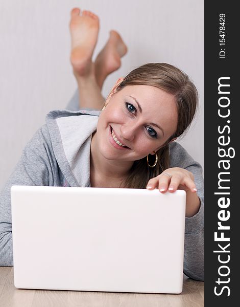 Closeup portrait of a young woman using a laptop