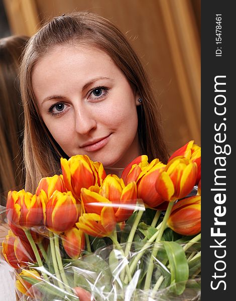 Blonde holding bunch of flowers