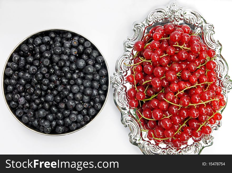 Fresh redcurrant and Blueberries on a silver platter