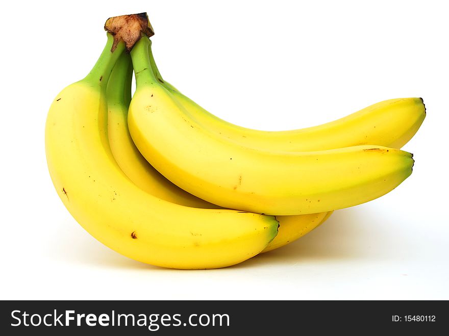 Golden bananas on white background