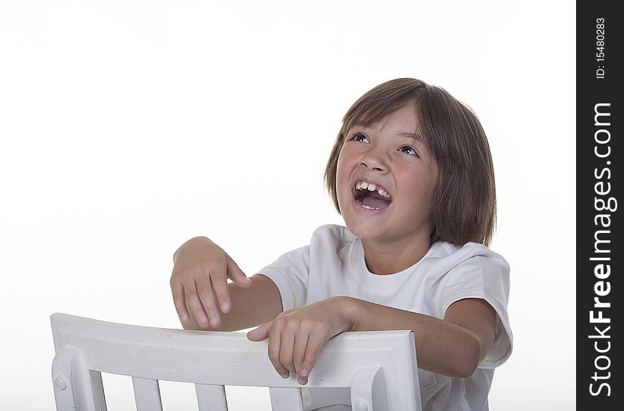 A young girl in a studio setting laughs loudly. A young girl in a studio setting laughs loudly.