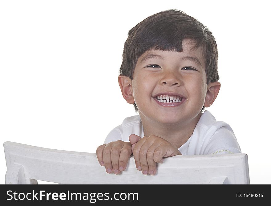 A cheerful young boy in a studio portrait. A cheerful young boy in a studio portrait.