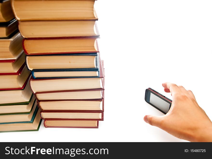 Row of books and mobile phone on white background. Row of books and mobile phone on white background