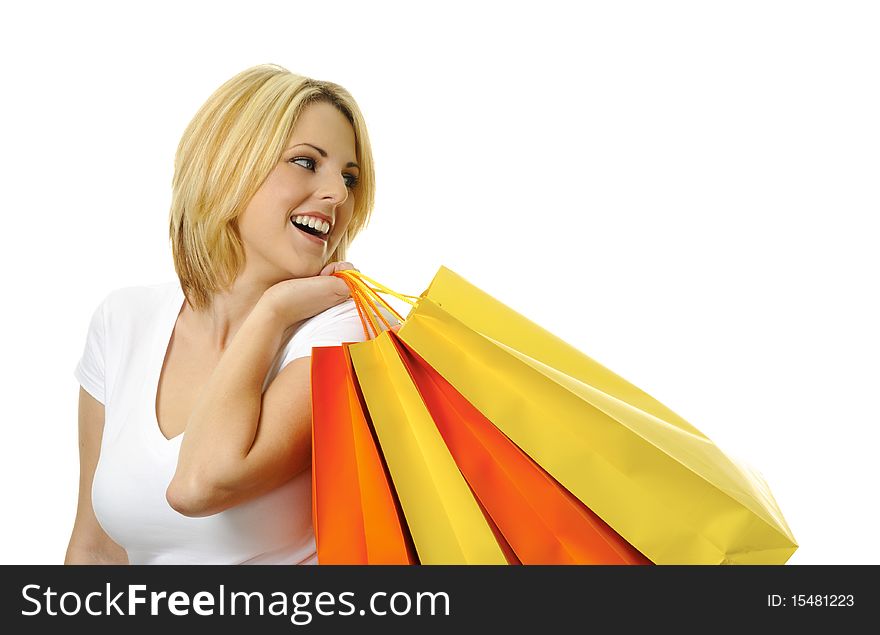 Pretty young woman with yellow and orange shopping bags. Pretty young woman with yellow and orange shopping bags