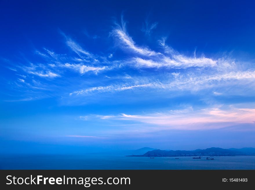 Blue sky and sea with slight cloud