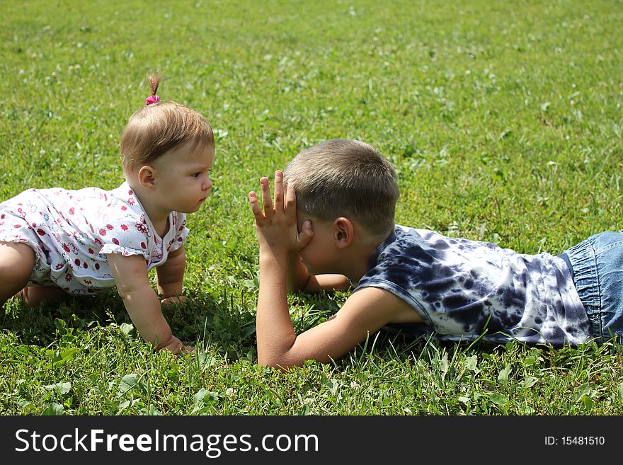 Children play on a grass