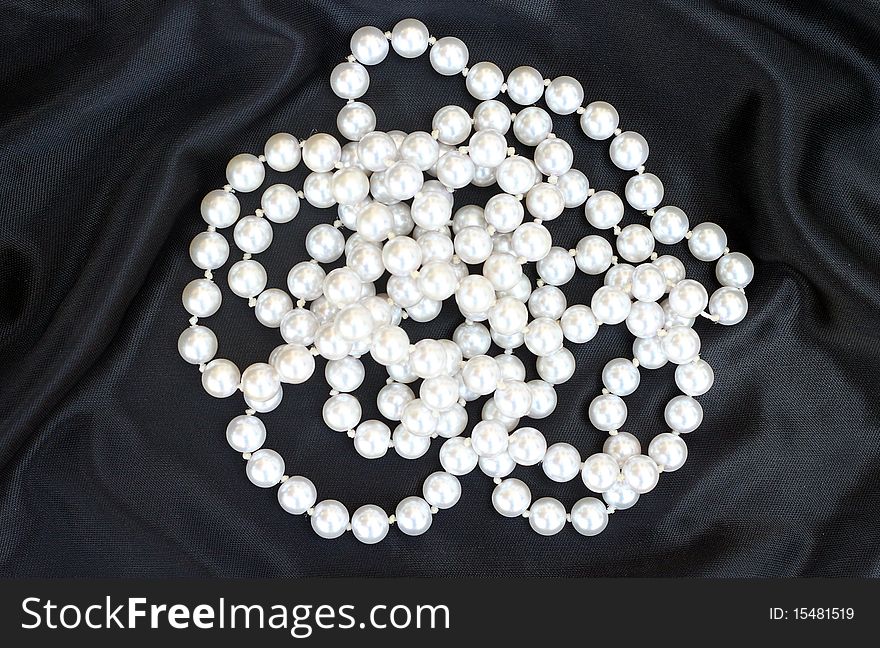 Pearl necklace on a black background. Pearl necklace on a black background