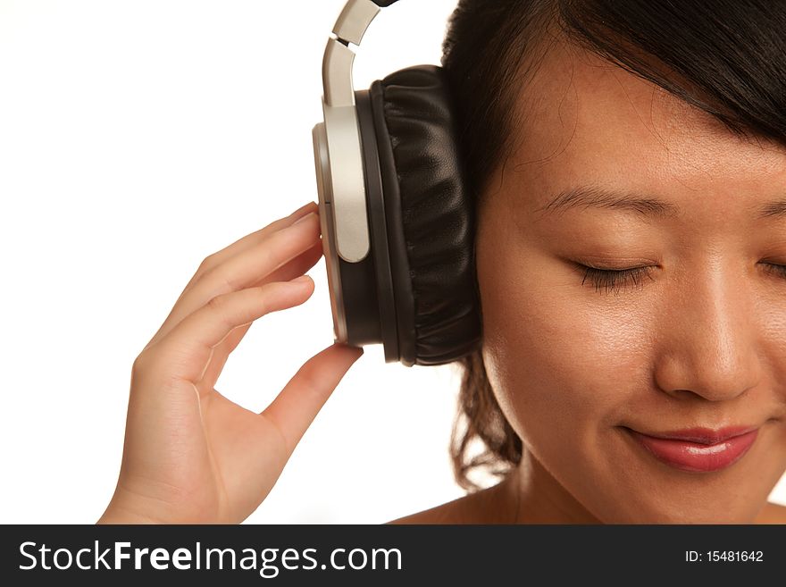 Woman listening to Music isolated on white