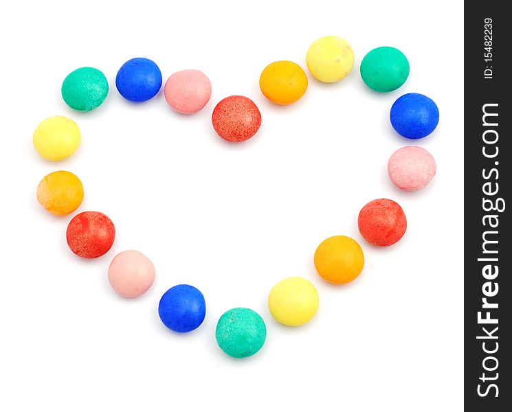 Heart symbol formed with color candies. Heart symbol formed with color candies