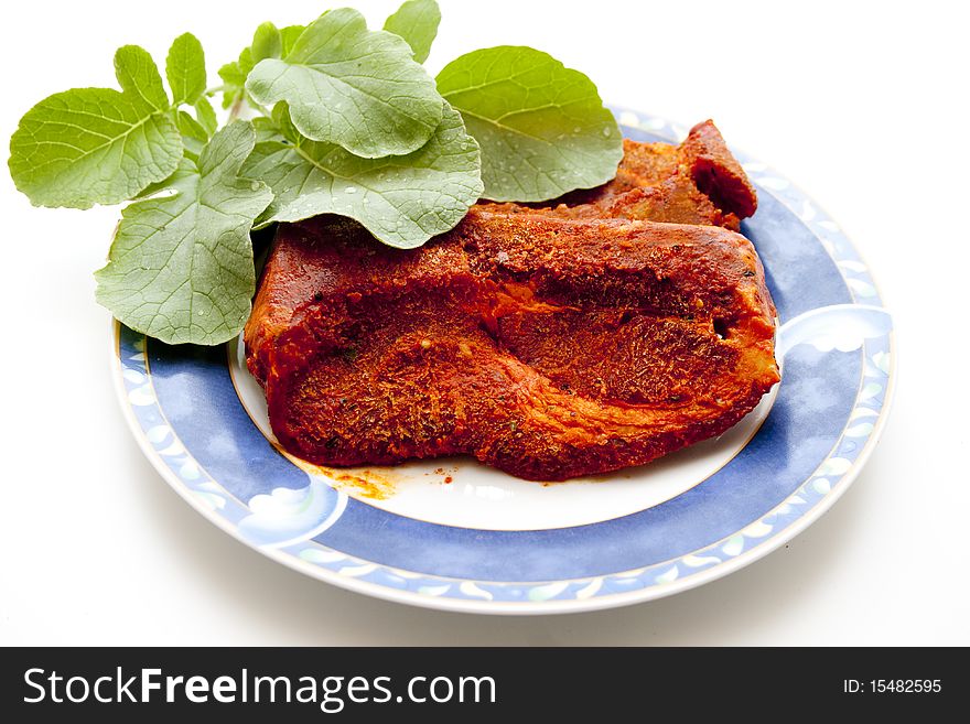 Steak piquantly seasoned and leaves. Steak piquantly seasoned and leaves