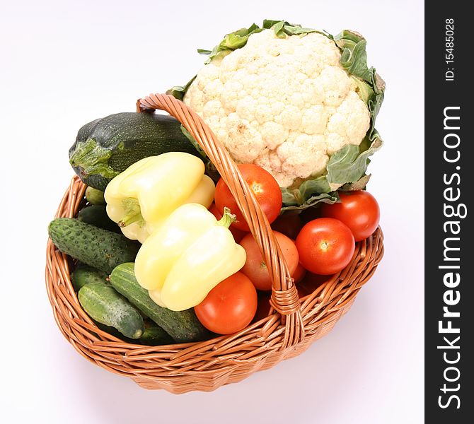 Basket full of vegetables on white background. Basket full of vegetables on white background