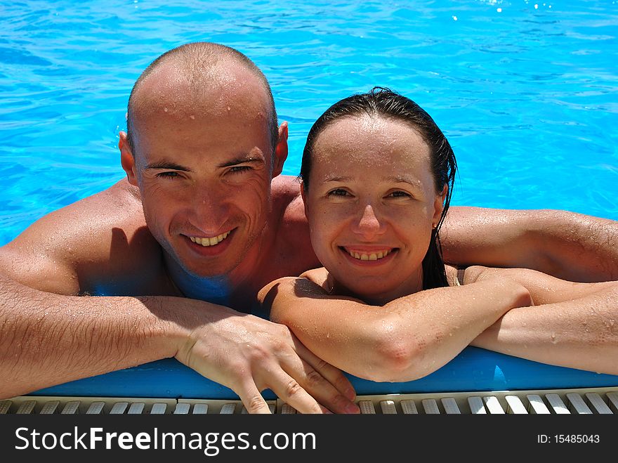 Happy couple in the pool