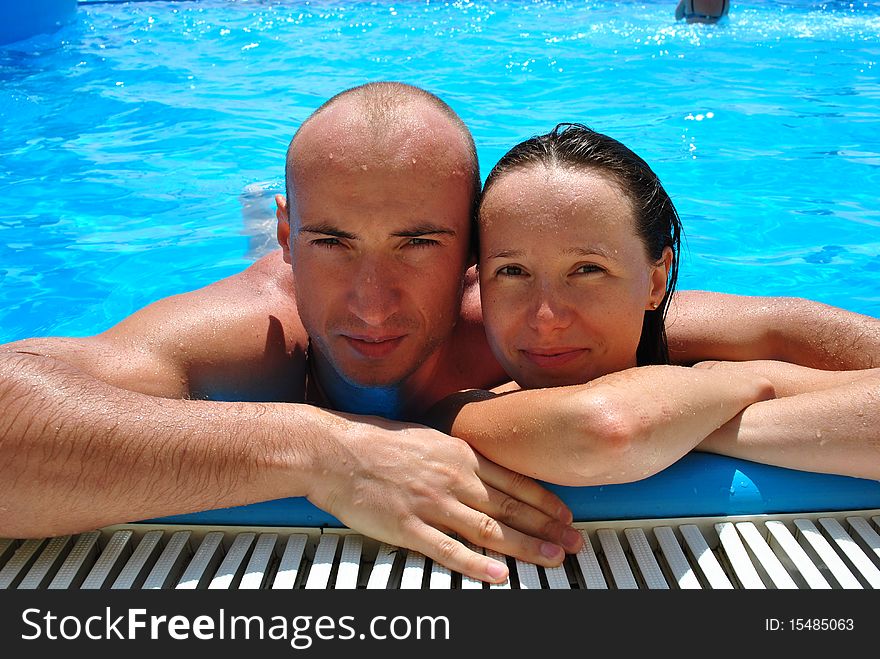 Happy couple in the pool