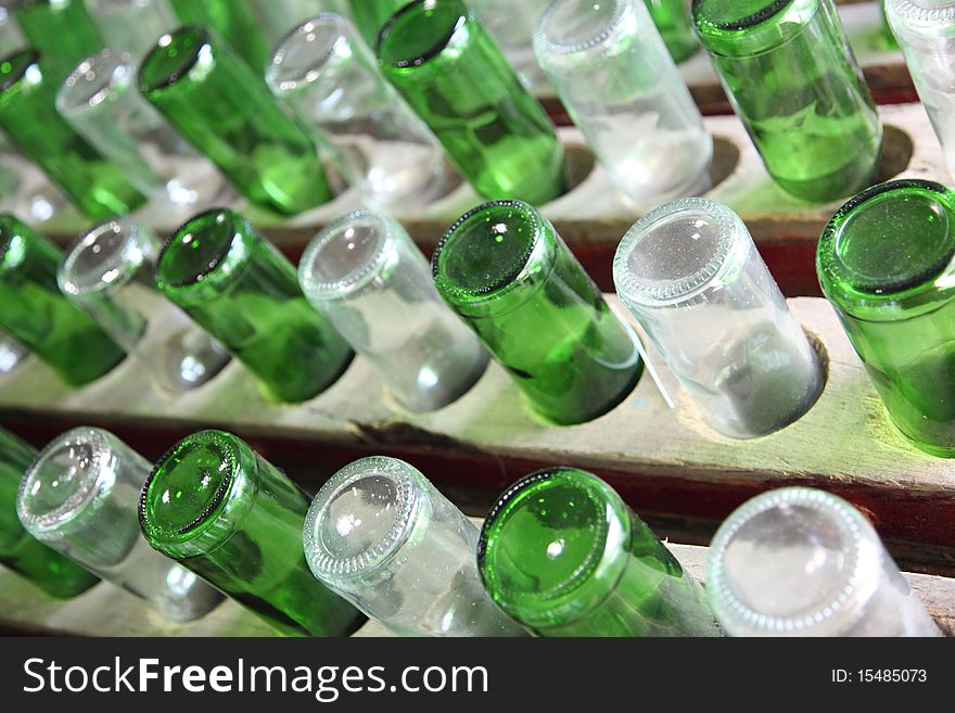 Group of green and white recycled glass wine bottles