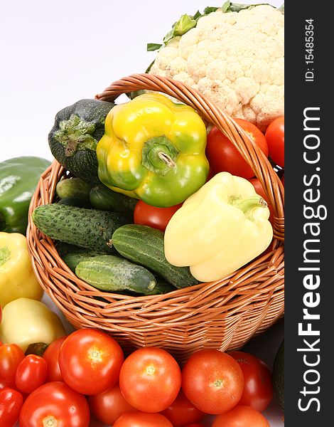 Basket full of vegetables on white background. Basket full of vegetables on white background