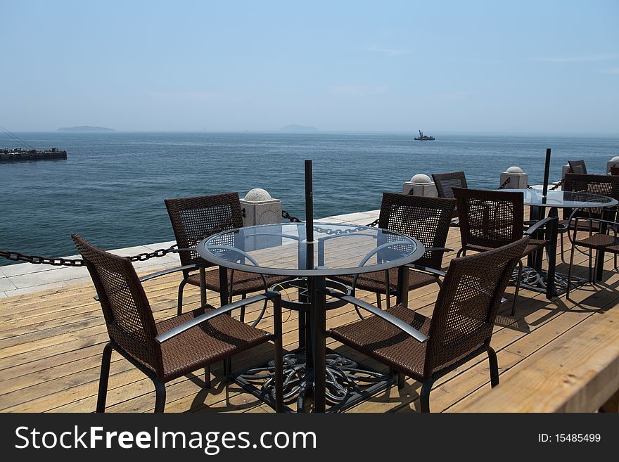 Leisure chairs and table at beach