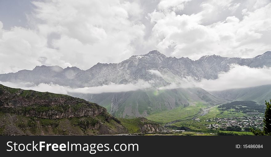 Mountain chain above the clouds in Georgia - Kazbegi. Mountain chain above the clouds in Georgia - Kazbegi