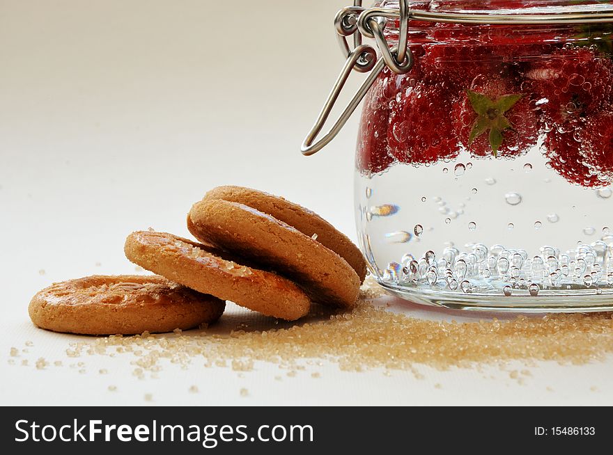 Biscuits with raspberries on a white background