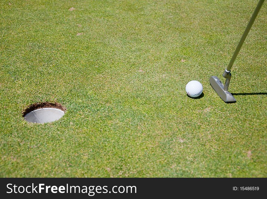 Golf hole with ball and putt. Golf hole with ball and putt