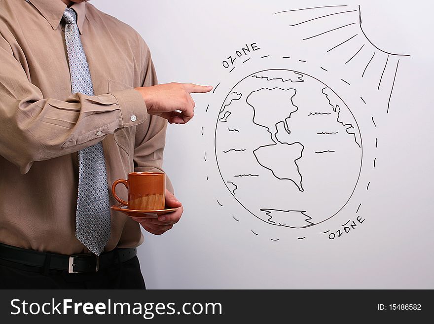 Man in a shirt and a tie pointing to a diagram of the earth's ozone layer. Man in a shirt and a tie pointing to a diagram of the earth's ozone layer.
