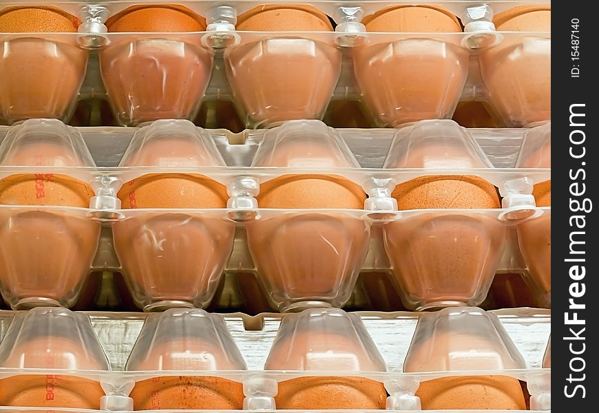 Eggs in plastic box on the shelf in a shop. Eggs in plastic box on the shelf in a shop