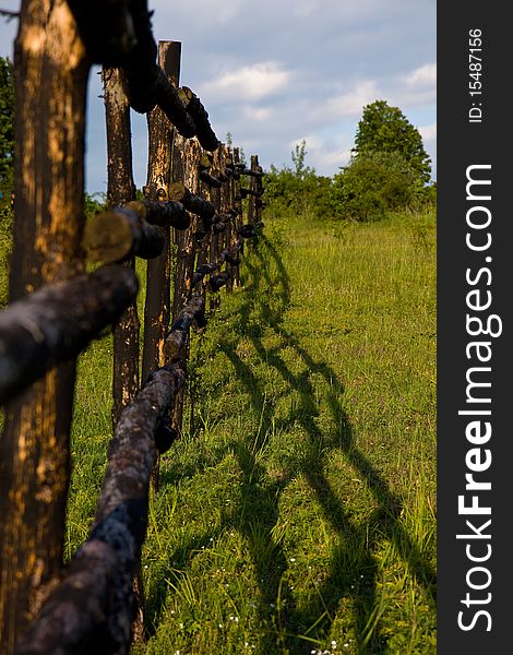 Meadow and wooden fence