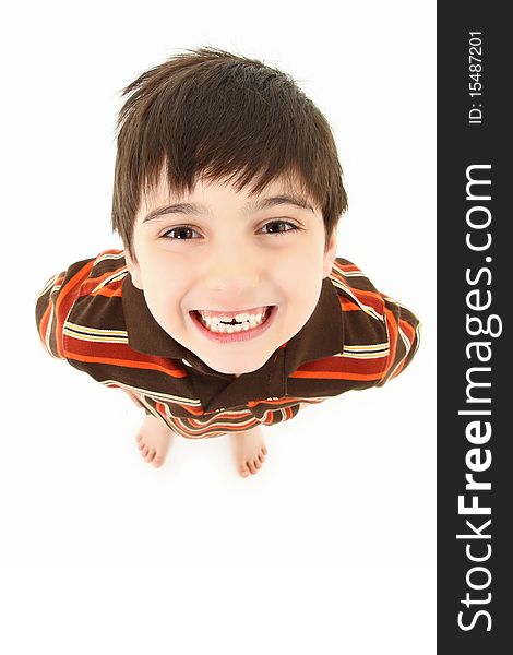 Adorable seven year old french american boy smiling up towards camera over white background. Adorable seven year old french american boy smiling up towards camera over white background.
