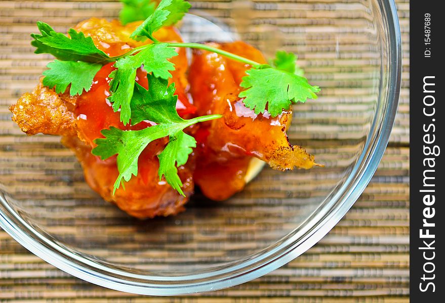 Spicy oriental chicken with fresh coriander leaves.