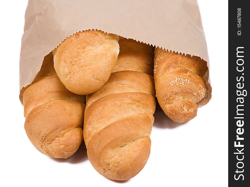 Isolated bread in paper packet on white