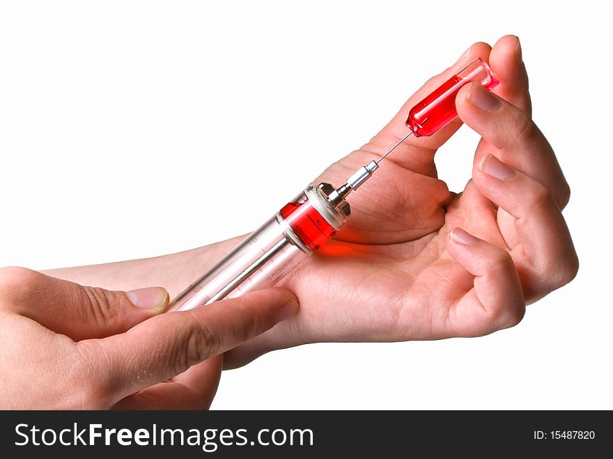 Hands holding a syringe and ampoule isolated on white. Hands holding a syringe and ampoule isolated on white