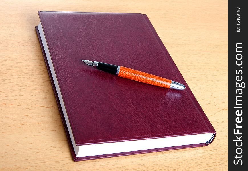 Notebook and pen on the table