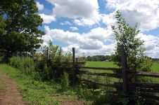 Clouds Over A Fenced In Pasture Stock Photos
