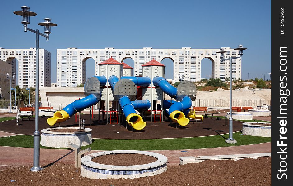 Children playground with home building as a background