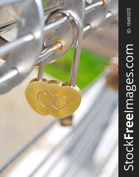 The golden lock in the form of hearts