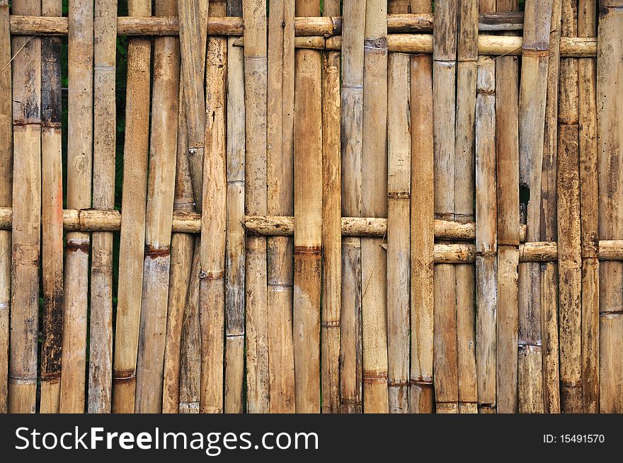 A fence made from bamboo material. A fence made from bamboo material