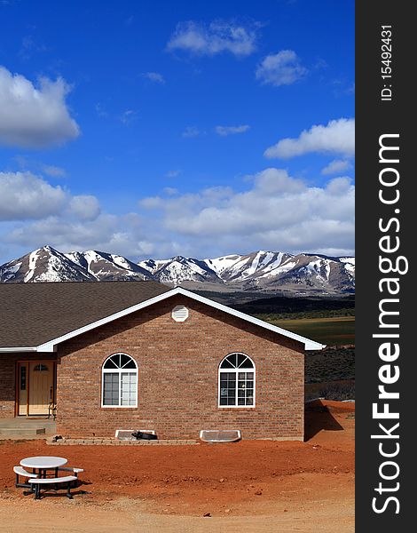 House in countryside with beautiful landscape on background,utah,USA. House in countryside with beautiful landscape on background,utah,USA