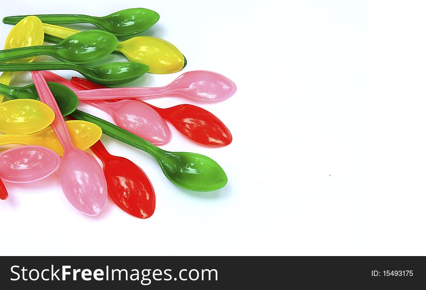 Arrangement Colorful Plastic Spoon with white background. Arrangement Colorful Plastic Spoon with white background