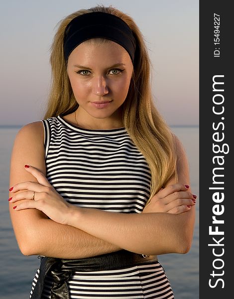 Closeup photo of pretty young woman at the seaside. Closeup photo of pretty young woman at the seaside