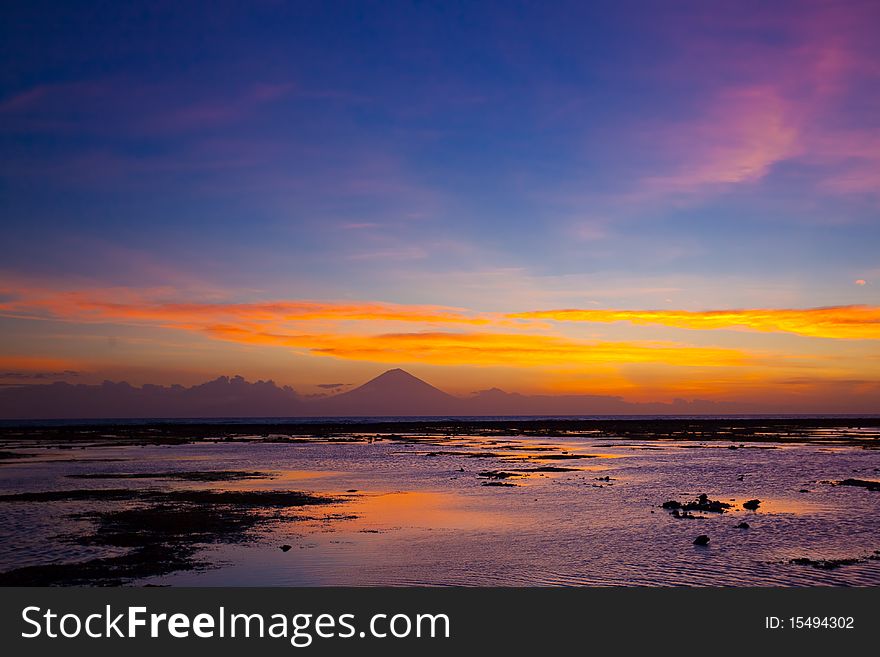 Tropical sunset on the beach. Travangan island. Indonesia